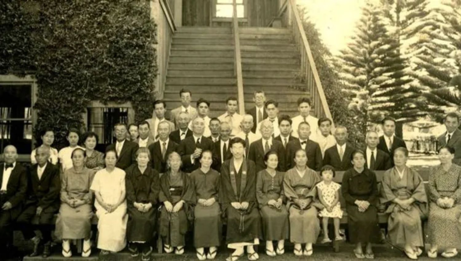 January blog post of big group of people all sitting to take a picture at the bottom of the steps.