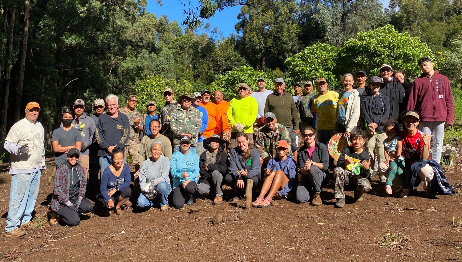 March blog photo of many volunteers together smiling after a long day of work.