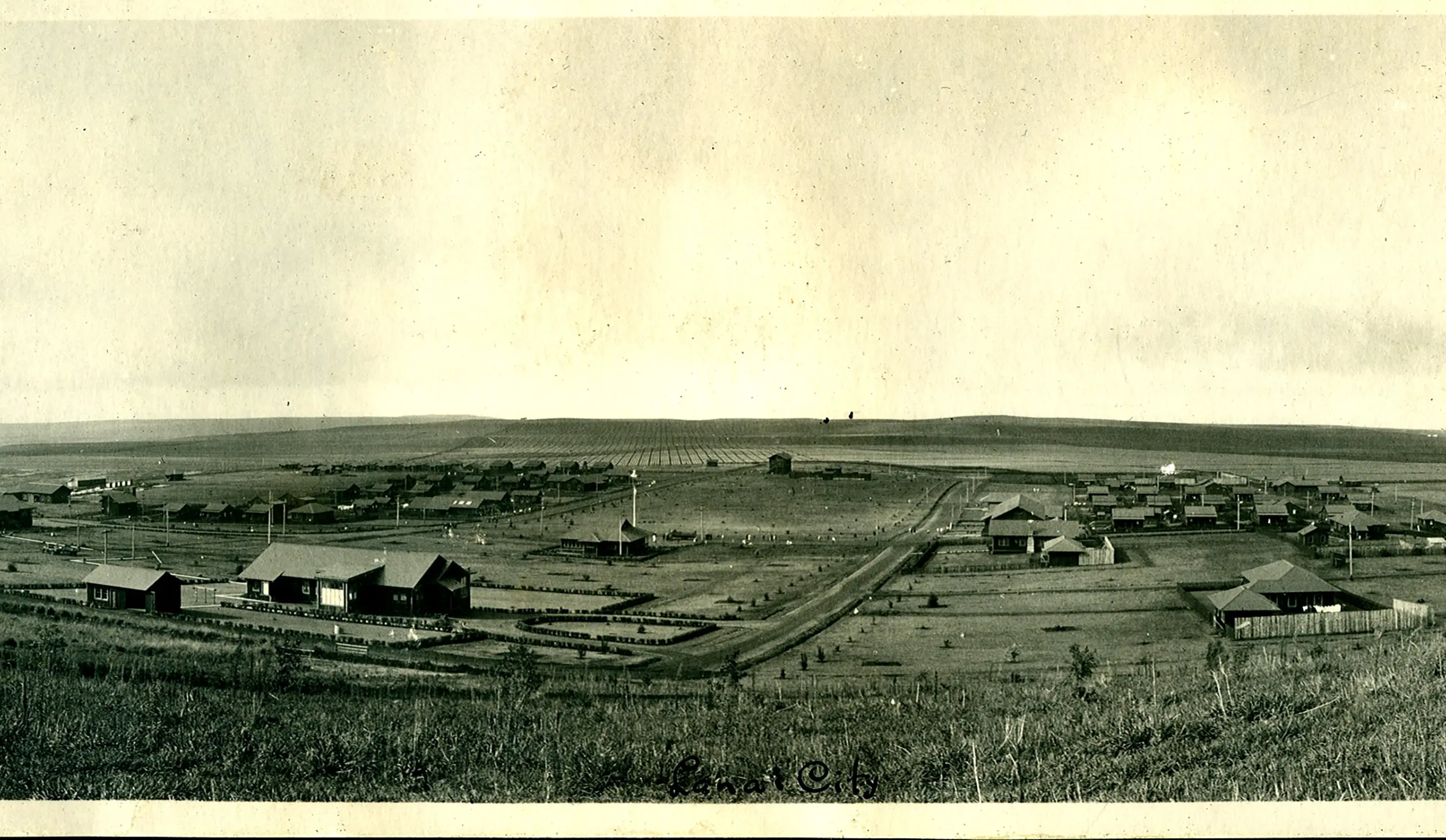 Old photo of the Lanai landscape, capturing the island's rugged beauty with rolling hills, sparse vegetation, and a distant horizon.