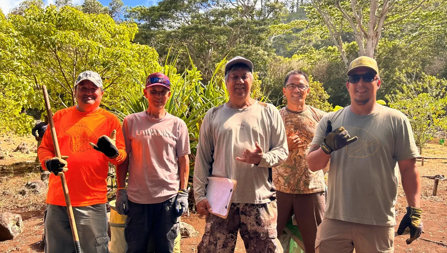 Group standing together while working outside.